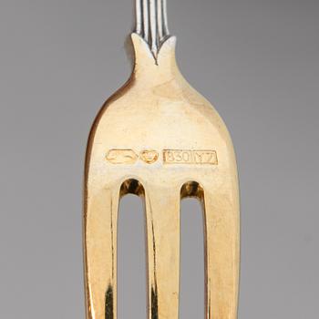 A set of Fabergé parcel-gilt silver dessert cutlery, 11 pieces + one fork later manufactured by Kultakeskus, Finland.