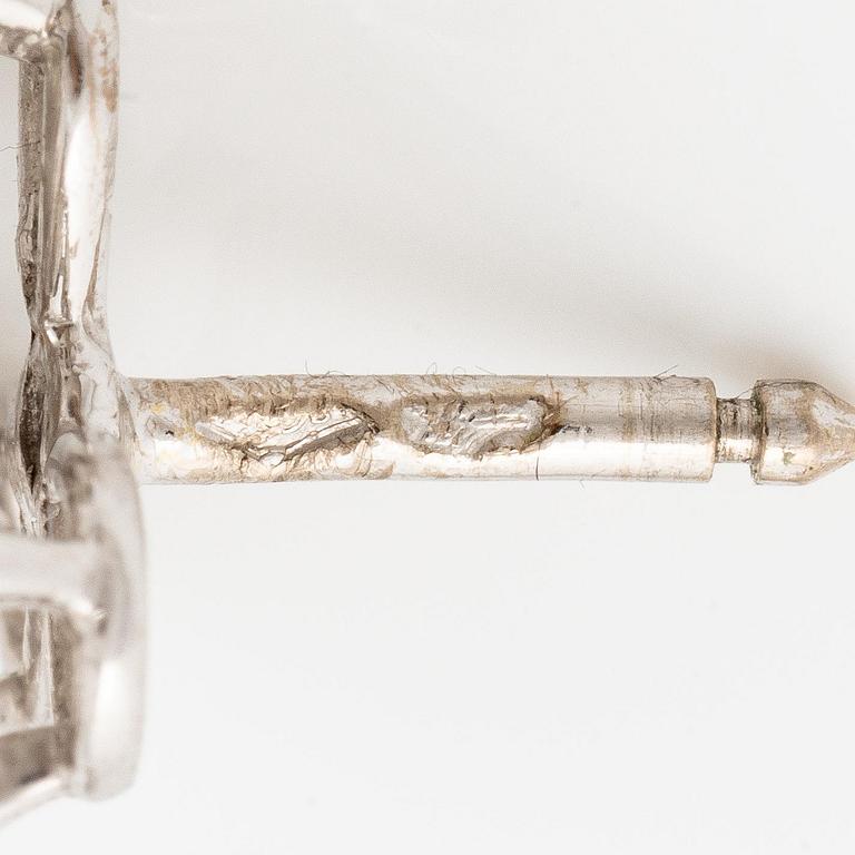 A pair of Cartier earrings in 18K white gold with six heart-shaped brilliant-cut diamonds.