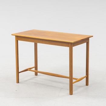 Josef Frank, a model 1106 walnut table, Firma Svenskt Tenn, Sweden.