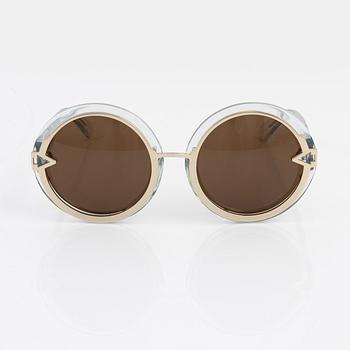 Karen Walker, a pair of "Orbit" sunglasses.