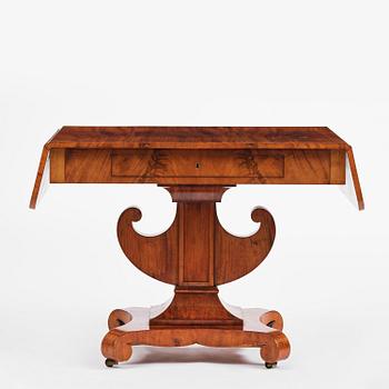A Swedish Empire mahogany center table.