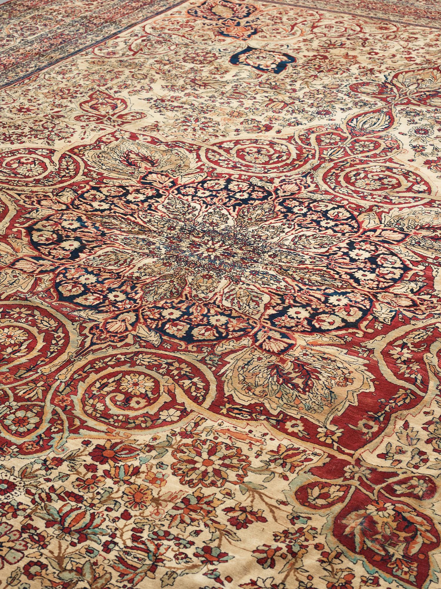 A carpet, an antique Kerman Laver, ca 677-688,5 x 510,5-526 cm.