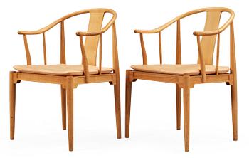 81. A pair of Hans J Wegner cherrywood and beige leather 'China chairs', Fritz Hansen, Denmark 1988.
