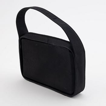 Gucci, a black satin handbag.