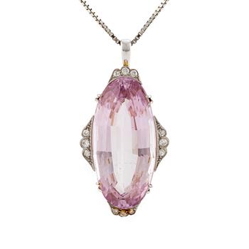 503A. A pendant in 18K gold and platinum with a faceted kunzite.