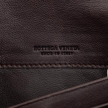 Bottega Veneta, a brown leather wallet.