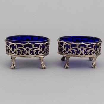 A pair of English 18th century silver and blue glass salt-cellars, unidentified makers mark, London 1767.