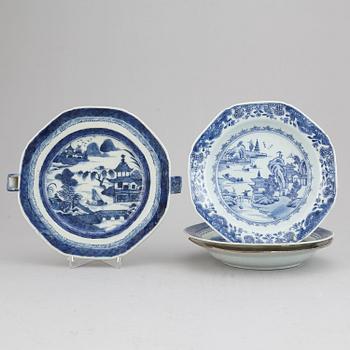 A set of three blue and white plates and a hot water dish, Qing dynasty, 18th/19th Century.