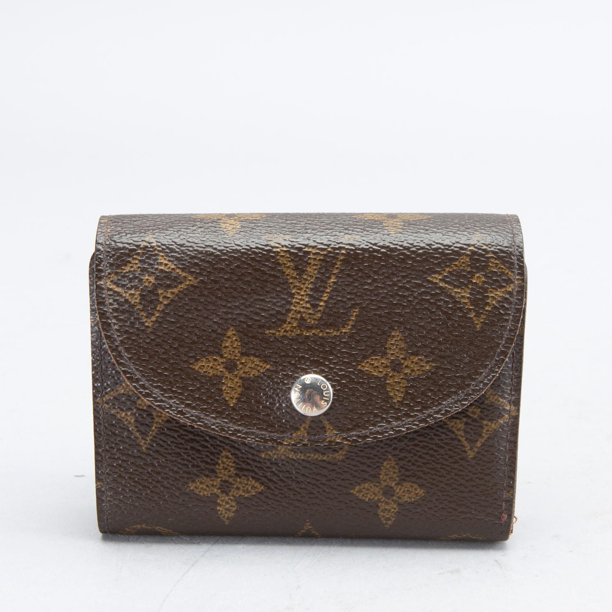 An 'Helene' wallet by Louis Vuitton.