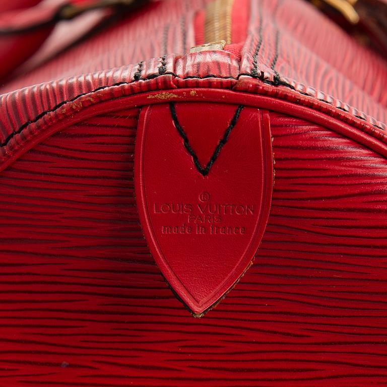 A RED EPI LEATHER KEEPALL TRAVEL BAG.