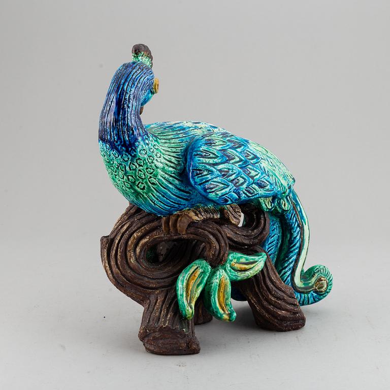GUNNAR NYLUND, a stoneware figurine of a peacock, Rörstrand.
