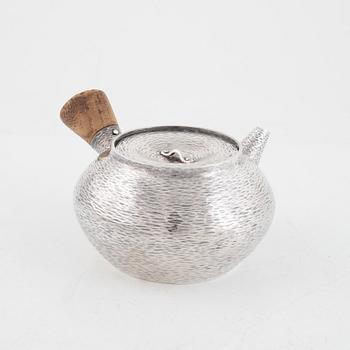 A silver teapot, first part of the 20th century.