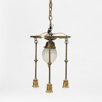An Art Nouveau brass and glass table light, early 20th Century.