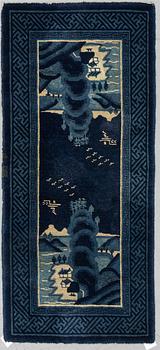 A RUG, semi-antique Baotou, China, ca 137 x 67 cm.