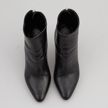 PRADA, a pair of black leather boots, size 35.