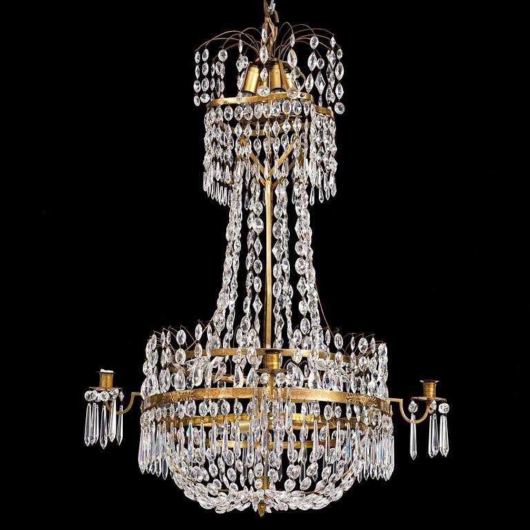 A late-Gustavian five-light gilt brass and cut glass chandelier, Stockholm, circa 1800.