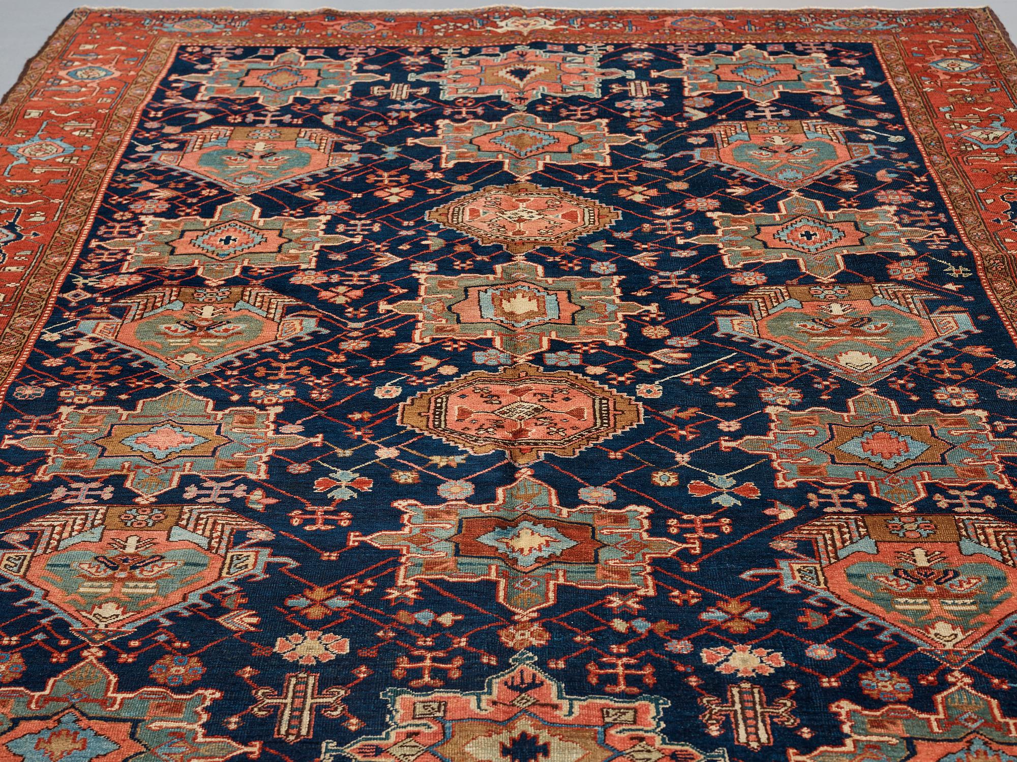 A CARPET, a semi-antique Heriz, 335,5-337,5 x 237-240 cm.