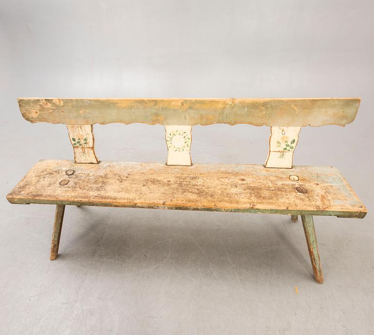 A painted early 1900s bench.