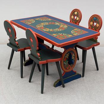 A second half of the 20th Century dining table and four chairs painted by the Hungrarian artist Laszlo Holló.