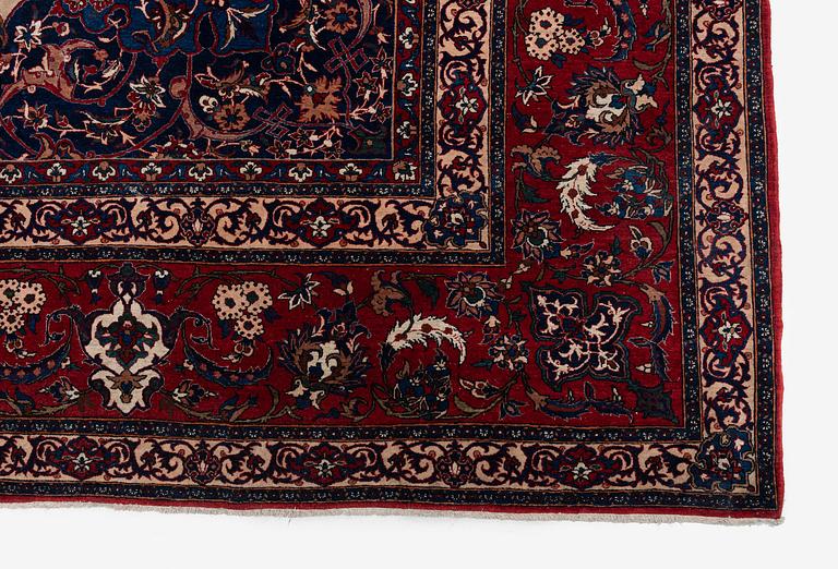 A semi-antique Isfahan carpet, Central Iran, c. 432 x 319 cm.