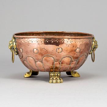 A 19th century copper and brass flower pot.