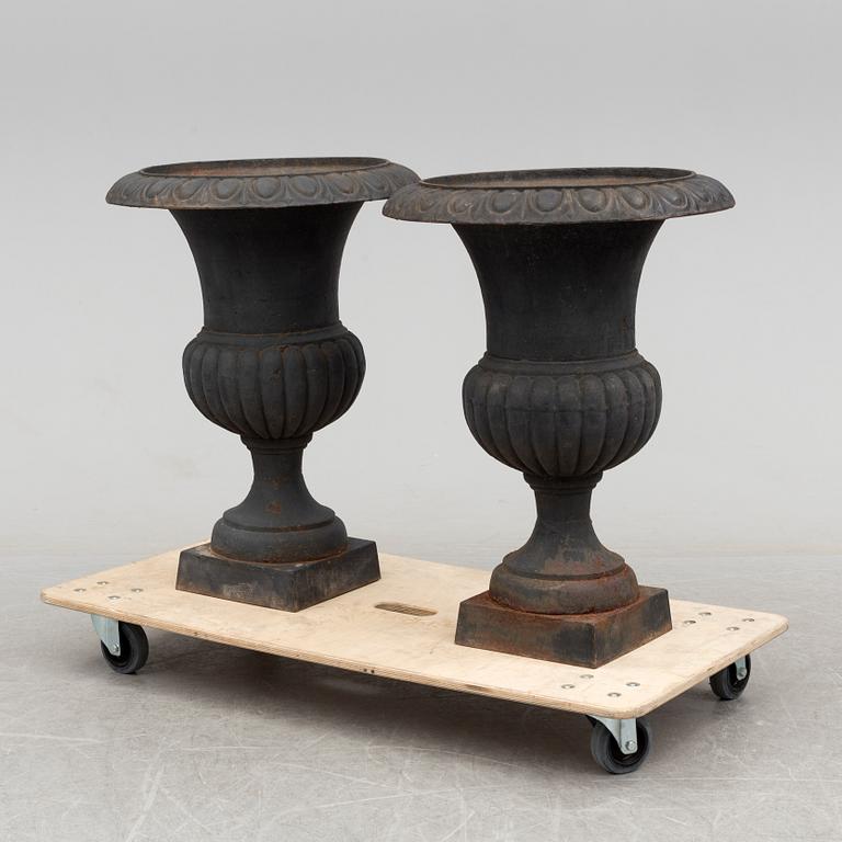 A pair of cast iron plant pots, late 20th century.