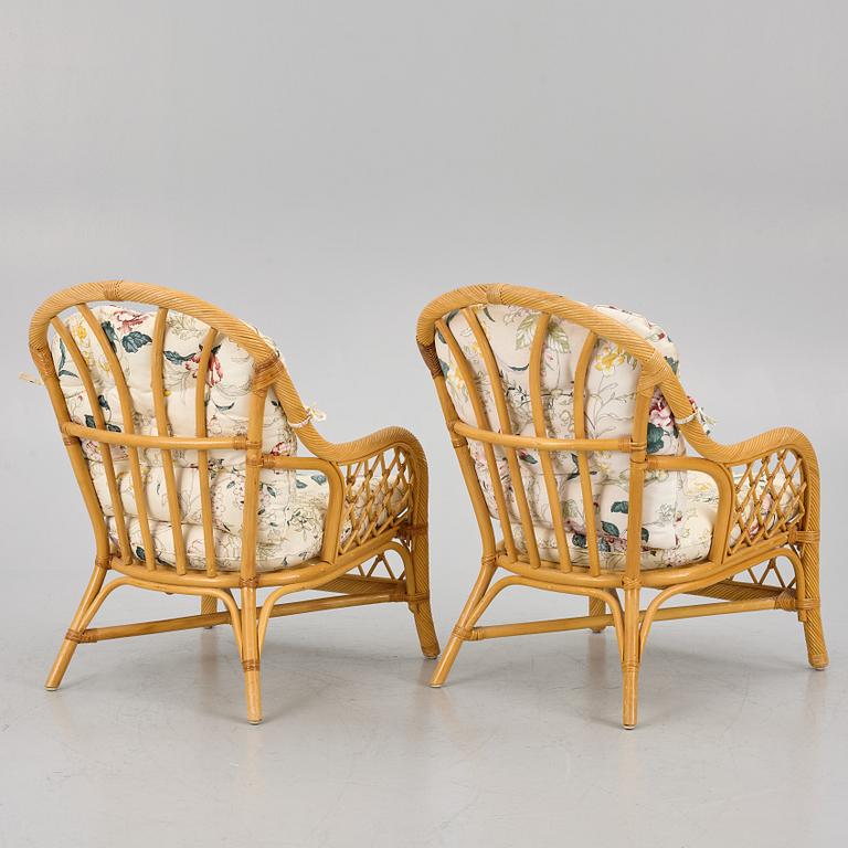 A rattan sofa and two armchairs, later part of the 20th century.