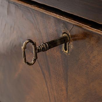 A mahogany-veneered sideboard, England, around 1900.