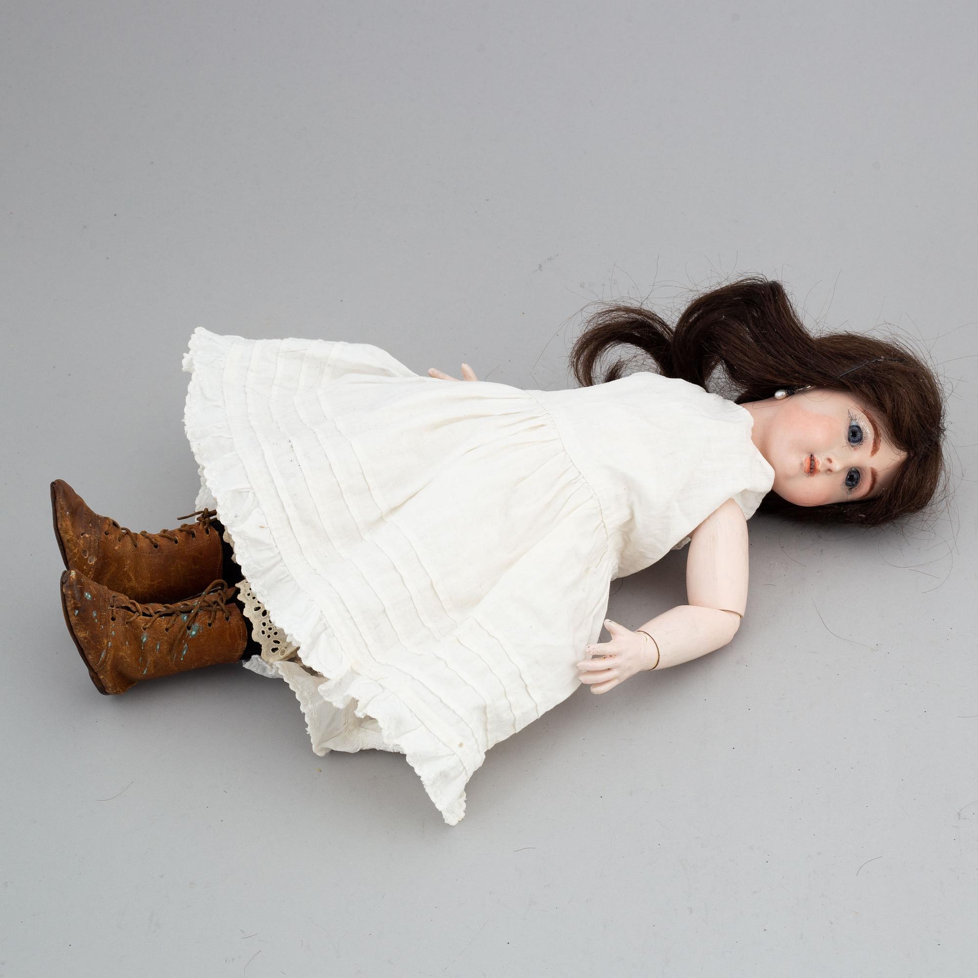 A Jullien Jeune bisque head doll.