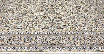 A Keshan carpet, signed, 397 x 302 cm.
