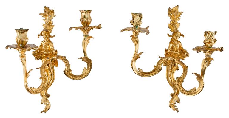 A pair of Louis XV 18th Century Chinoiserie gilt bronze two-light wall-lights.