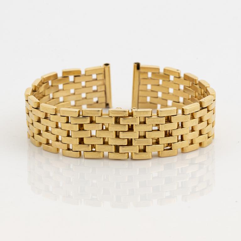 An 18K gold watch bracelet.
