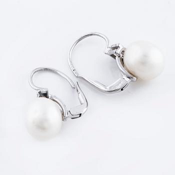 A pair of cultured pearl and ca 1.10 cts brilliant cut diamond earrings.