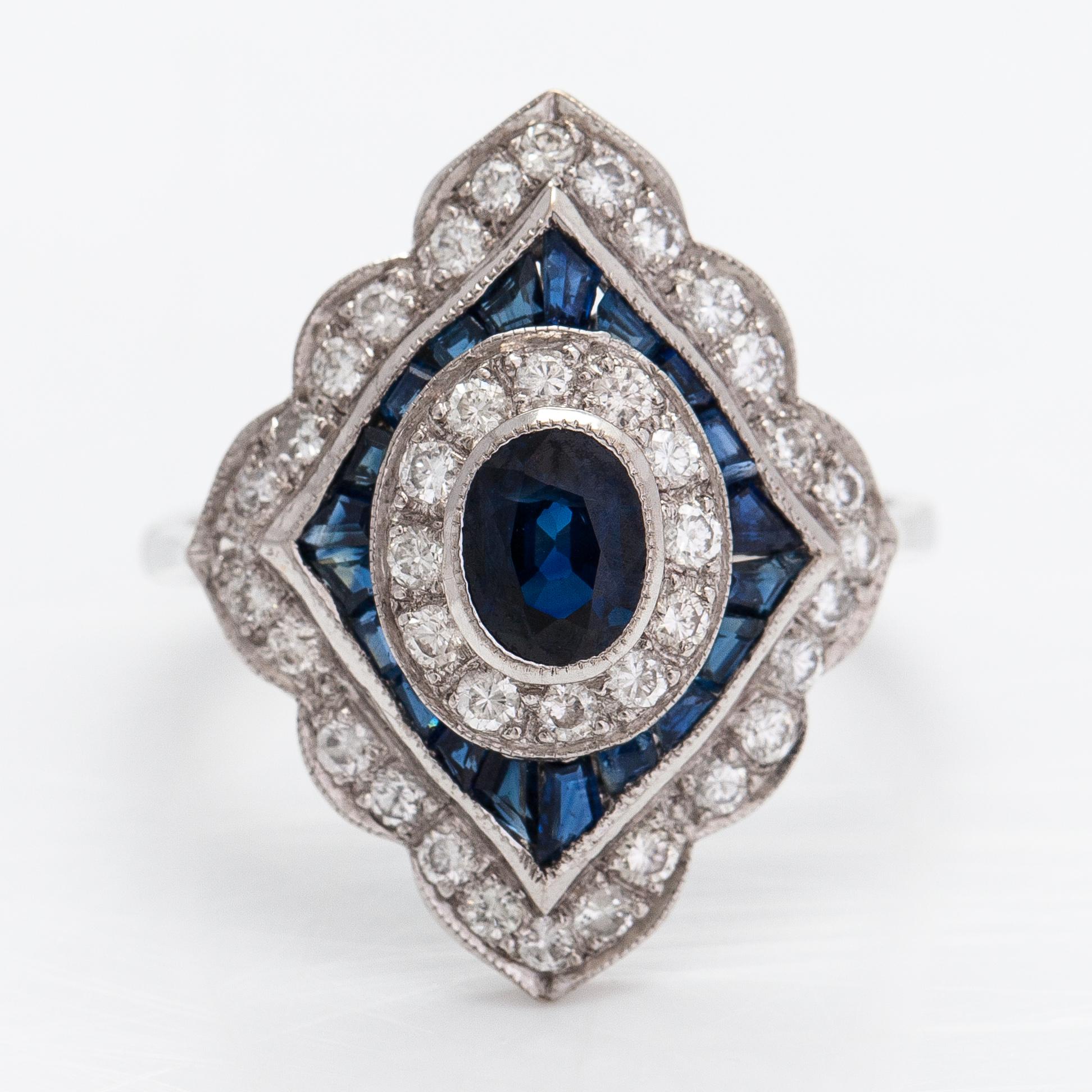 Ring, 18K vitguld, diamanter ca 0.60 ct totalt och safirer.