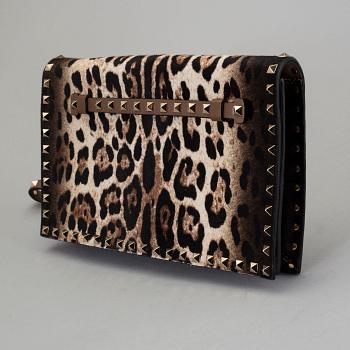 A ponyhair clutch with studs by Valentino.