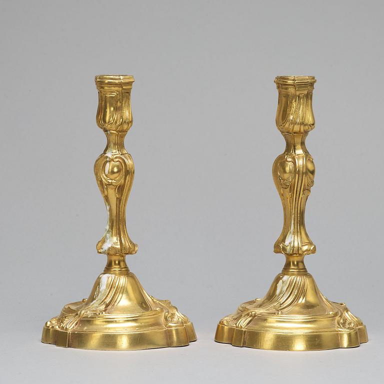 A pair of Louis XV-style candlesticks, circa 1900.