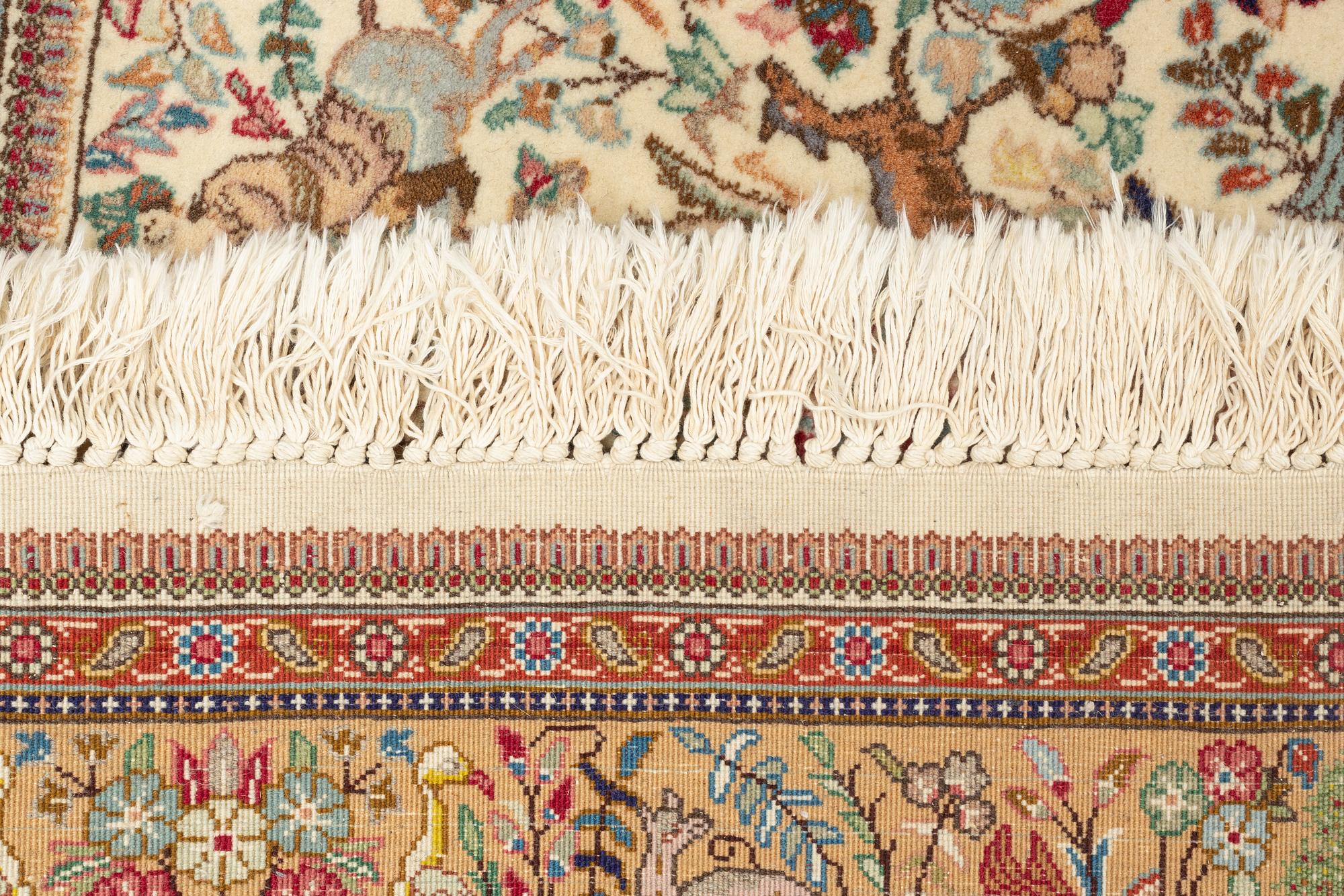 A Tabriz carpet, 270 x 180 cm.