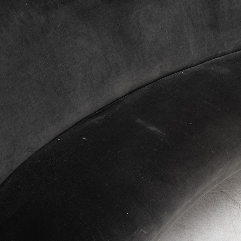 A curved sofa with velvet covering, 20th Century,