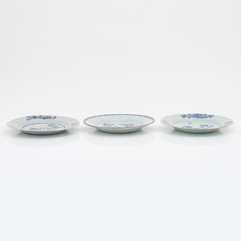 A blue and white serving dish and eight odd plates, Qing dynasty, 18th Century.