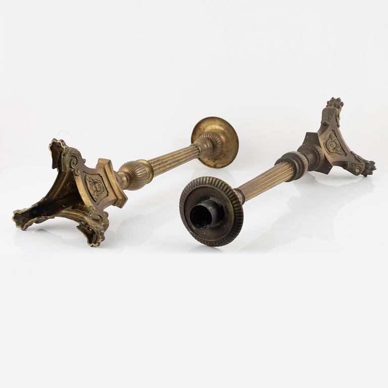 A pair of Baroque style brass altar candleholders, circa 1900.