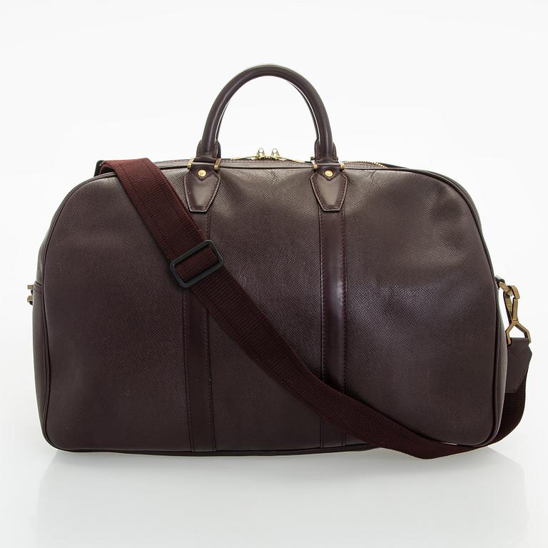 Louis Vuitton, a 'Taiga Kendall PM' weekend bag.