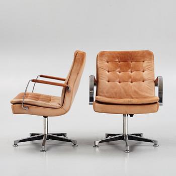 Kenneth Bergenblad, a pair of leather upholstered armchairs from Dux, designed 1978.