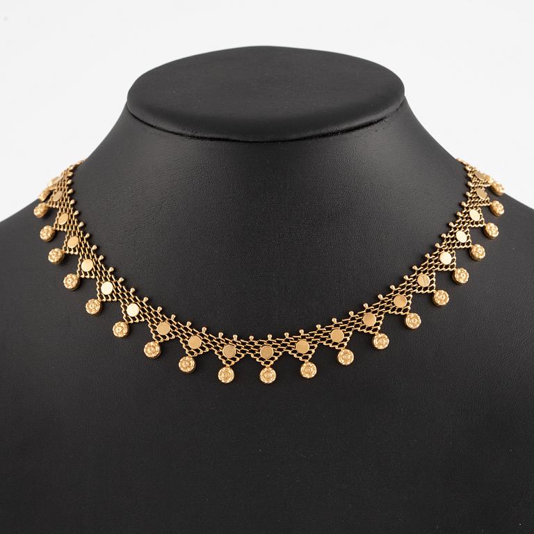 18K gold necklace.