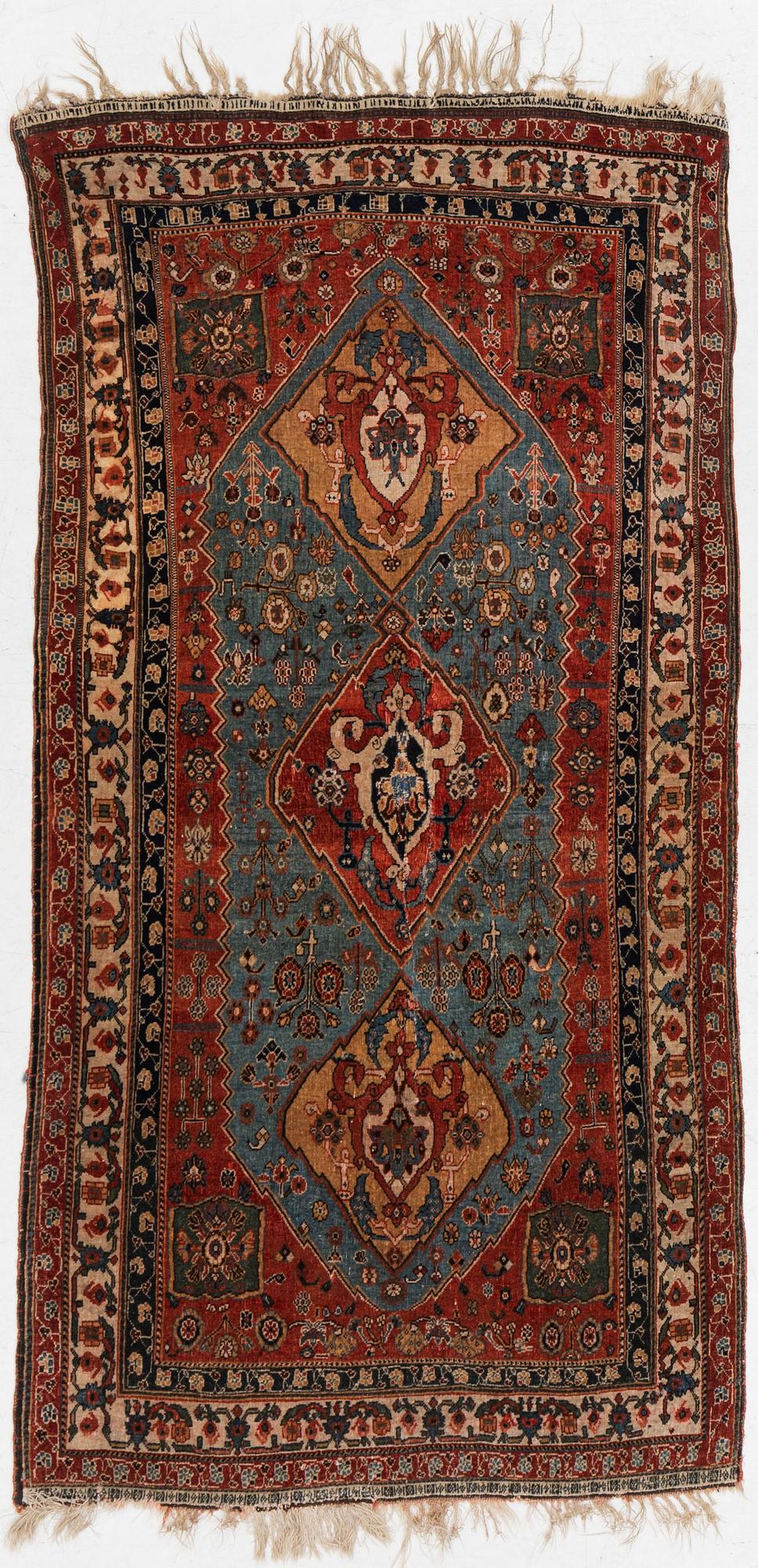 An antique Qashqai rug, southeastern Iran, c 204 x 102 cm.