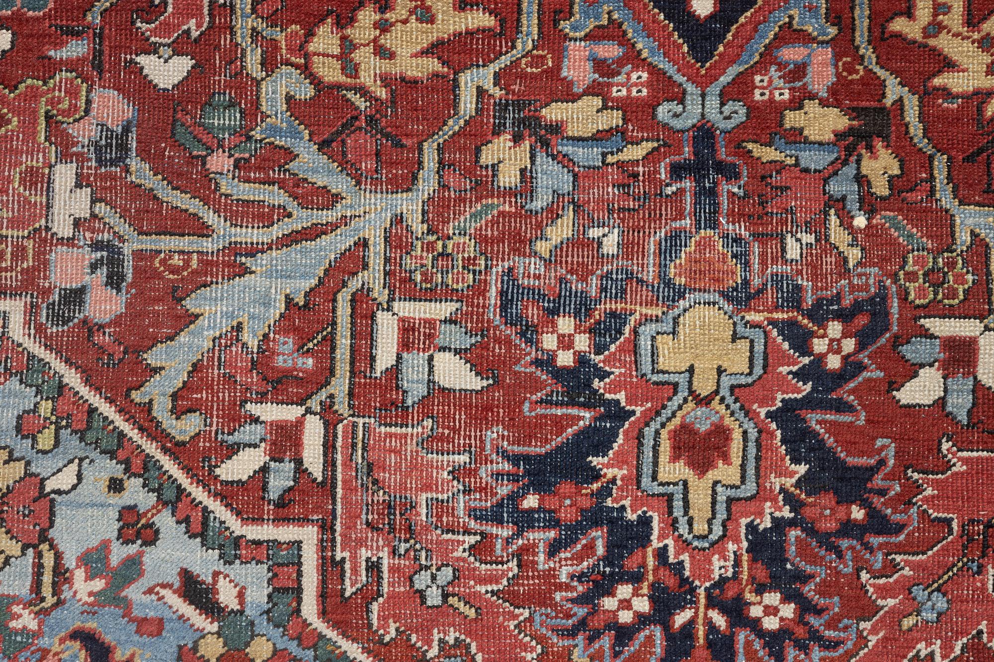 An Antique Heriz carpet, North west persia, c. 380 x 310 cm.