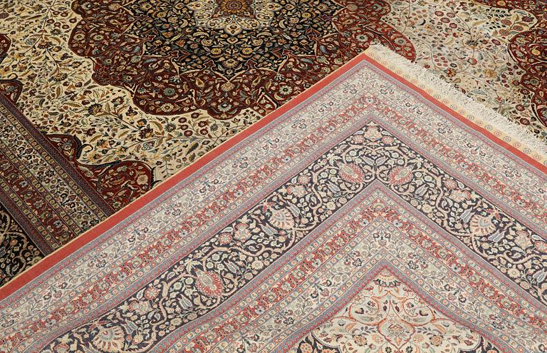 An Oriental silk carpet, c. 436 x 306 cm.