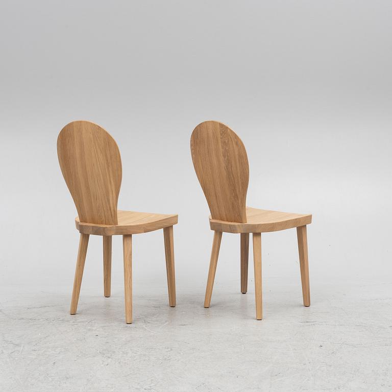 Carl Malmsten, a pair of "Skedblad" chairs, Tre Sekel, Sweden, 21st century.