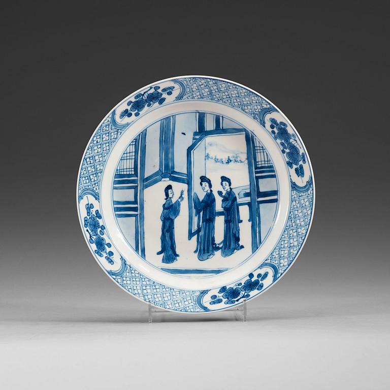 A set of four odd blue and white dinner plates, Qing dynasty, Kangxi (1662-1722), with different six character marks.