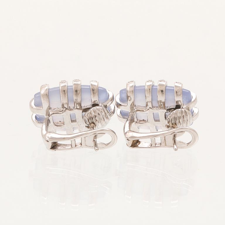 A pair of 18K white gold earrings with brilliant cut diamonds and possibly chalcedony.
