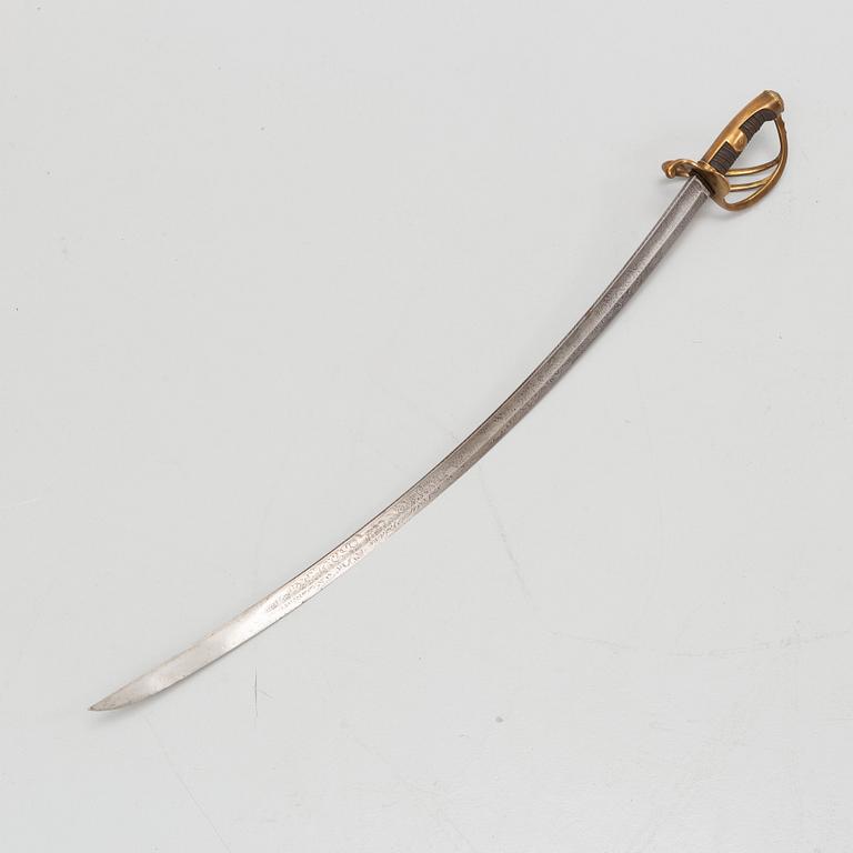 An 19th Century curved officer's sword with etched blade and steel scabbard.